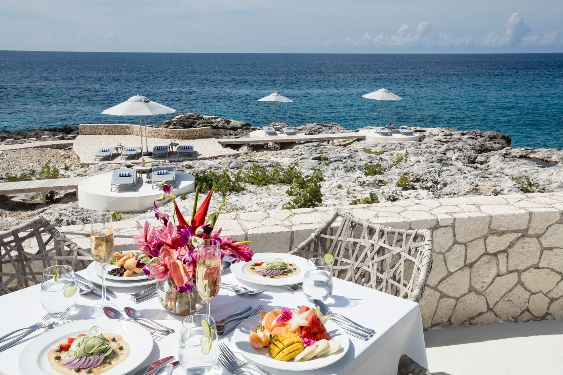 Tables at the restaurant at The Cliff Hotel & Spa, overlooking the sea