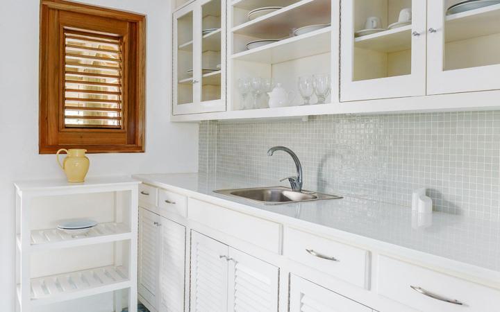 Bright white kitchen in a Garden Suite